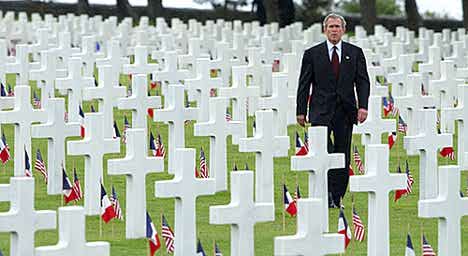 Bush among some fruits of his labor